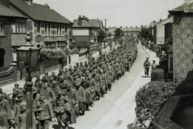German PoWs being marched down Grove Road, Gosport, after D-Day