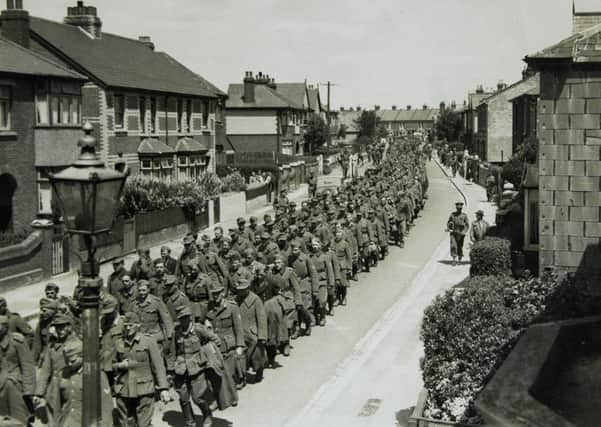 German PoWs being marched down Grove Road, Gosport, after D-Day