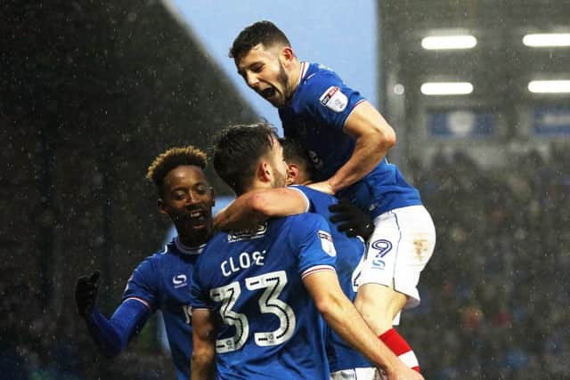 Pompey celebrate Ben Close's strike against AFC Wimbledon. Picture: Joe Pepler