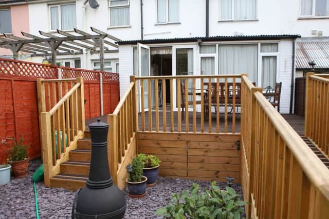 Disabled Anthony Langford may have to lower the decking installed in his back garden to help him get his scooter into his house, after he put it up without planning permission and neighbours complained