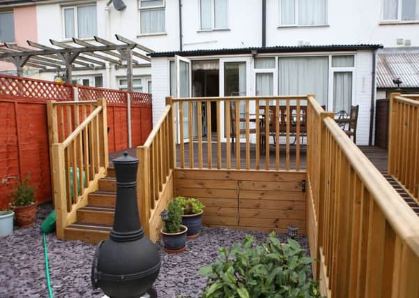 Disabled Anthony Langford may have to lower the decking installed in his back garden to help him get his scooter into his house, after he put it up without planning permission and neighbours complained