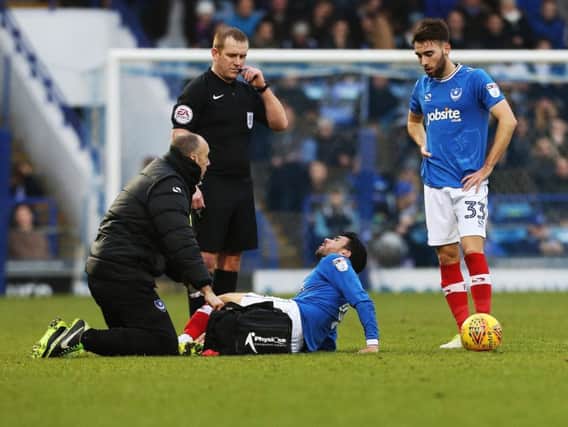 Danny Rose receives treatment before being substituted in the first-half of today's game