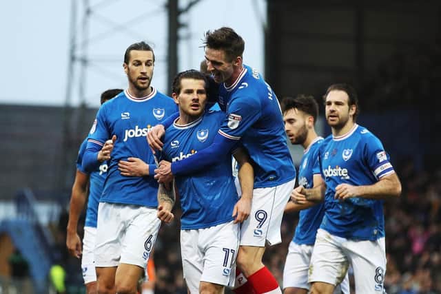 Matty Kennedy, centre, is congratulated for his goal in Pompey's 3-1 win over Northampton