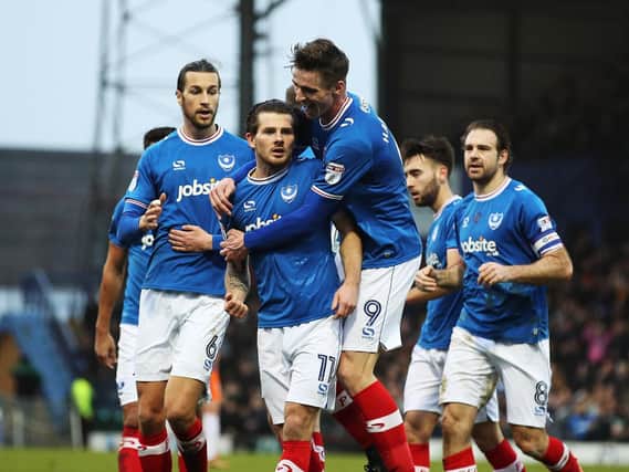 Matty Kennedy, centre, is congratulated for his goal in Pompey's 3-1 win over Northampton