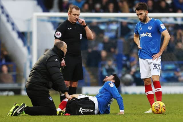 Danny Rose receives treatment on the pitch during Saturday's game with Northampton Picture: Joe Pepler