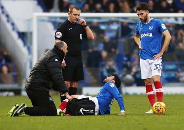Danny Rose receives treatment on the pitch during Saturday's game with Northampton Picture: Joe Pepler