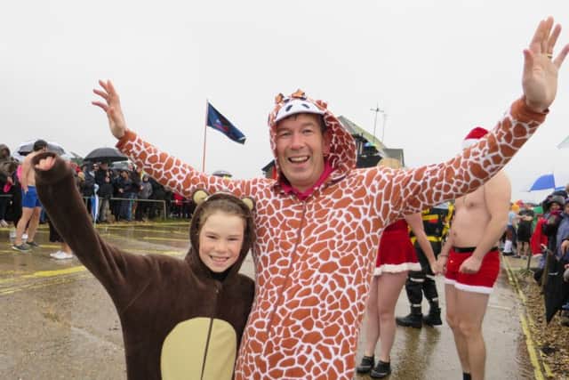 Little Ellie Hunter, 11, and her dad Simon Hunter, 48, at the New Year's Day dip at Stokes Bay in Gosport orgainsed by Gafirs