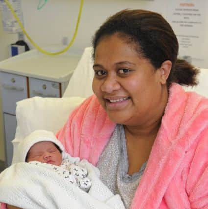 Mum Emy Rodelana with baby daughter Adi. Picture by Malcolm Wells