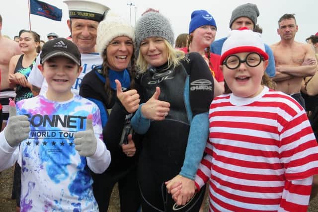 Danny Davies, Derek Peachey, Lisa Davies, Sharon Lewry and Madeline Lewry at the New Year's Day dip at Stokes Bay in Gosport 
Pictures: Ben Fishwick