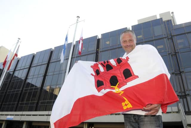 Stephen Sedgwick raises the Gibraltar flag outside the Civic Offices in Portsmouth for National Gibraltar Day in 2013