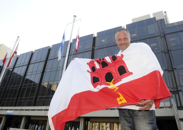 Stephen Sedgwick raises the Gibraltar flag outside the Civic Offices in Portsmouth for National Gibraltar Day in 2013
