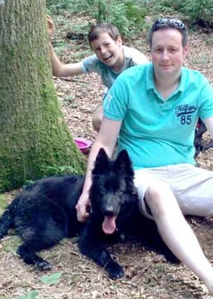 Skyla the dog  with Gavin Woodman and his son, Samuel