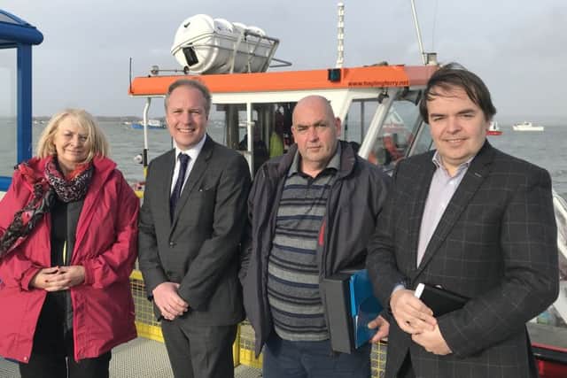 (L-r) Cllr Jackie Branson, Cllr Michael Wilson, Hayling Ferry skipper Colin Hill and Cllr Tim Pike in front of the Pride of Hayling boat