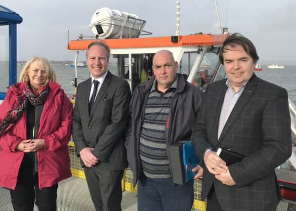 (L-r) Cllr Jackie Branson, Cllr Michael Wilson, Hayling Ferry skipper Colin Hill and Cllr Tim Pike in front of the Pride of Hayling boat