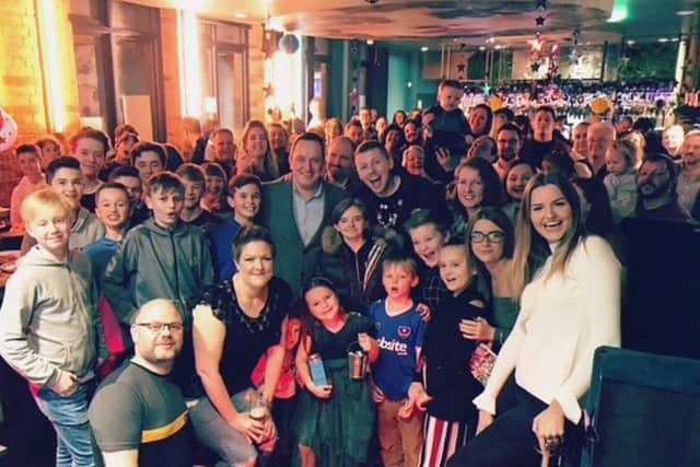 Ellie-May Sheridan, centre, with Professor Green, surrounded by her family and friend at a surprise party