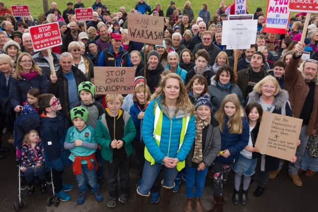 Protest organiser Rachel Follett (centre front) with fellow local residents. Picture: Duncan Shepherd