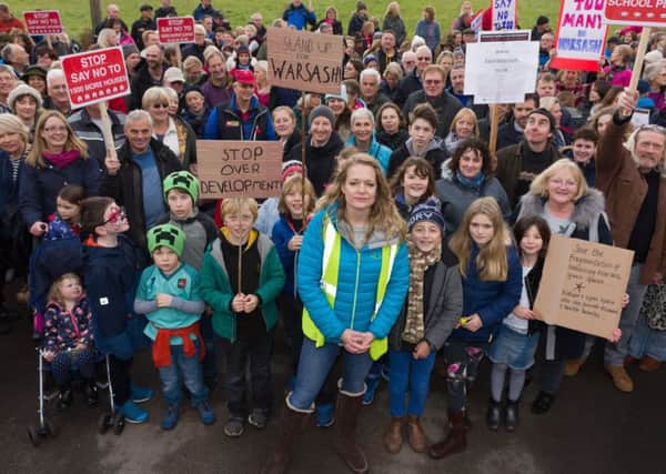 Protest organiser Rachel Follett (centre front) with fellow local residents. Picture: Duncan Shepherd