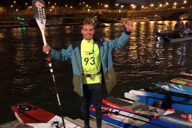 Phil McCoy celebrates after the Paris Crossing