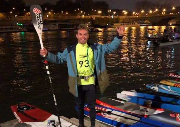 Phil McCoy celebrates after the Paris Crossing