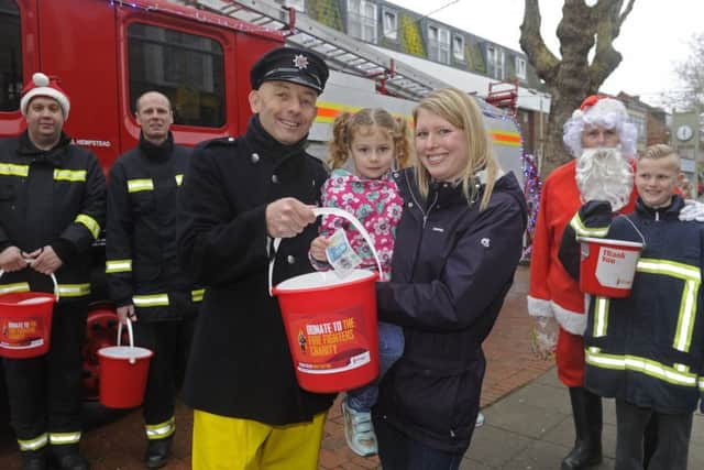 Firefighter Jasper Taylor with Claire Goldstone and her daughter Sophie (four), from Portchester.
Picture: Ian Hargreaves
