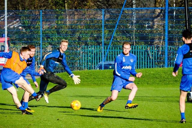 Connor Ronan takes a shot during his first Pompey training session. Pictures: Colin Farmery