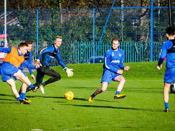 Connor Ronan takes a shot during his first Pompey training session. Pictures: Colin Farmery