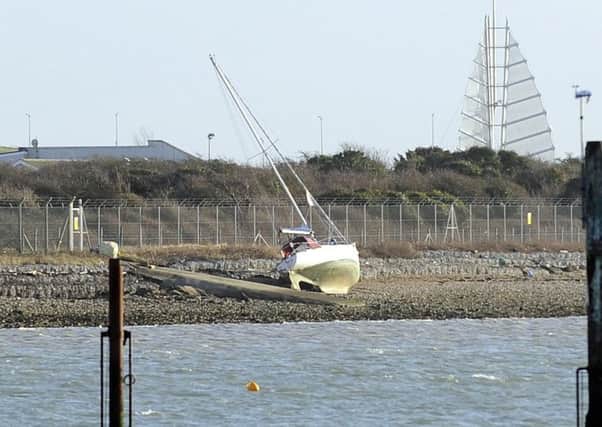 The grounded yacht of Tracey McNamee and Duncan Reynolds. The couple suffered a double blow after the vessel was ransacked. Picture by Malcolm Wells