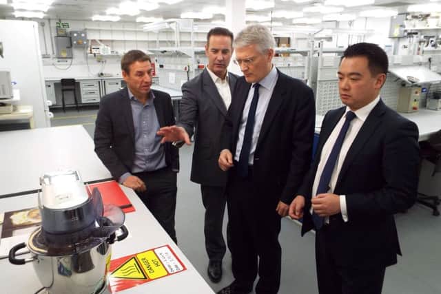 Havant MP Alan Mak and Andrew Jones MP in Kenwoods new customer experience centre with Mark Welch and Neal Jones from Kenwood