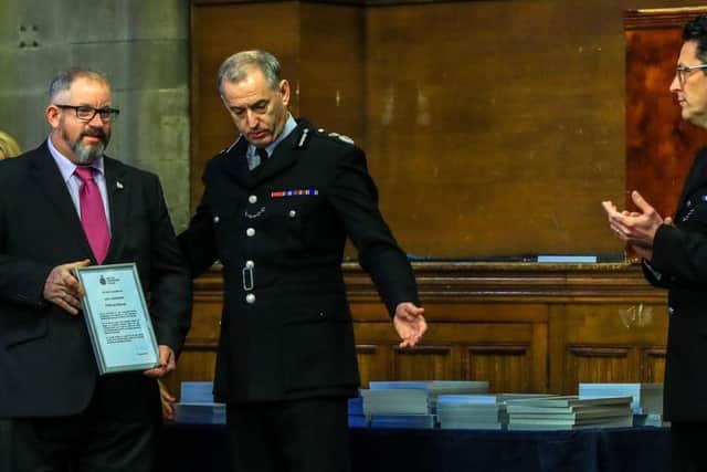 PCSO and former Royal Navy chef Jon Morrey (left) is highly commended during a commendation ceremony at Manchester Town Hall to recognise the actions of police and rail staff following the terrorist attack at Manchester Arena in May 2017. Photo: Peter Byrne/PA Wire