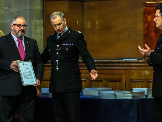 PCSO and former Royal Navy chef Jon Morrey (left) is highly commended during a commendation ceremony at Manchester Town Hall to recognise the actions of police and rail staff following the terrorist attack at Manchester Arena in May 2017. Photo: Peter Byrne/PA Wire