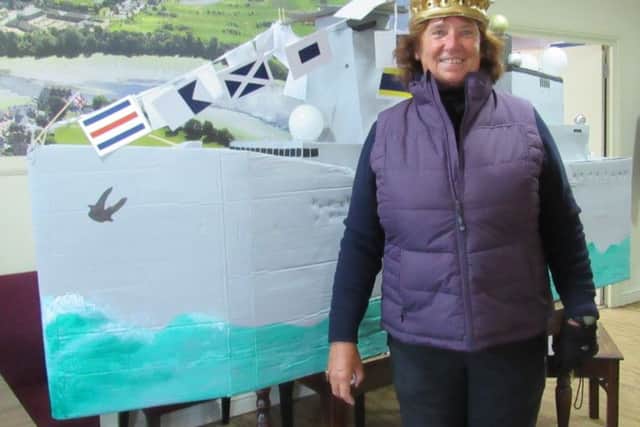 Royal Navy veteran Isabel Kent, the new ladies' captain at Cams Hall Estate Golf Club
with her warship on her first day in the role