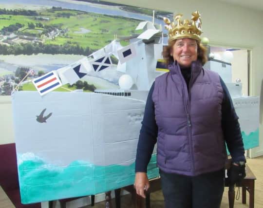 Royal Navy veteran Isabel Kent, the new ladies' captain at Cams Hall Estate Golf Club
 with her warship on her first day in the role