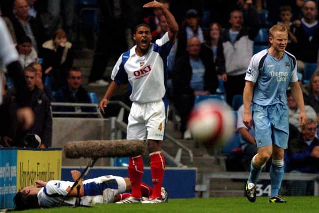 Pedro Mendes lies injured on the side off the pitch after Ben Thatchers challenge on him during the Manchester City v Pompey game in August 2006