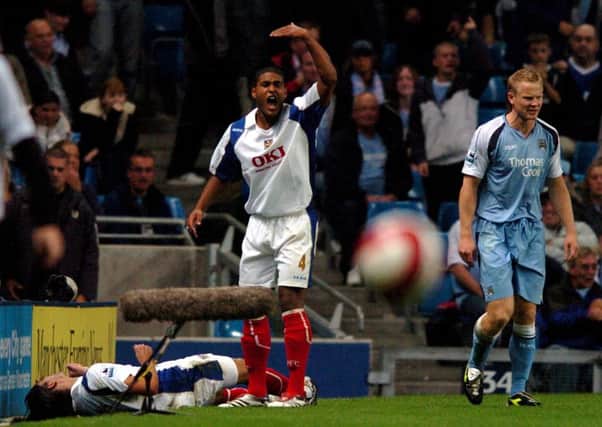 Pedro Mendes lies injured on the side off the pitch after Ben Thatchers challenge on him during the Manchester City v Pompey game in August 2006
