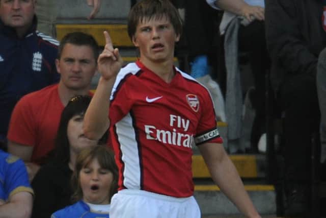 Arsenal's Andrey Arshavin seems to wave his finger in denial of a penalty after being brought down in the box by Pompey's Sean Davis in 2009