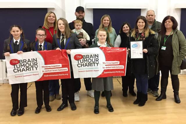 Daisy Smith, 11, third from left, helped raised thousands for charity