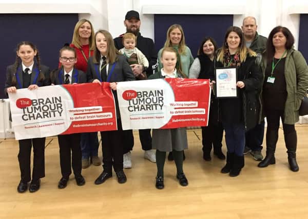 Daisy Smith, 11, third from left, helped raised thousands for charity