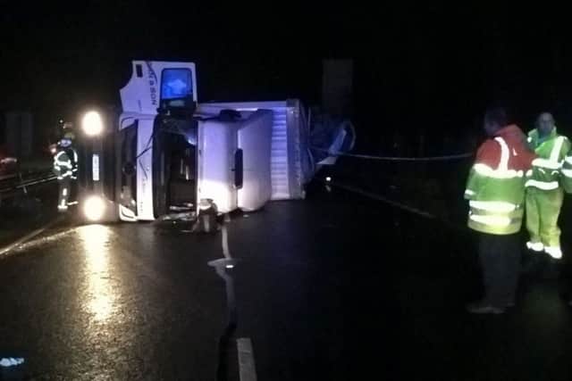 Cargo from the vehicle's 44-tonne load has spilled out across the highway.Photo: Hampshire police