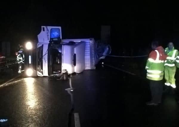 Cargo from the vehicle's 44-tonne load has spilled out across the highway.
Photo: Hampshire police