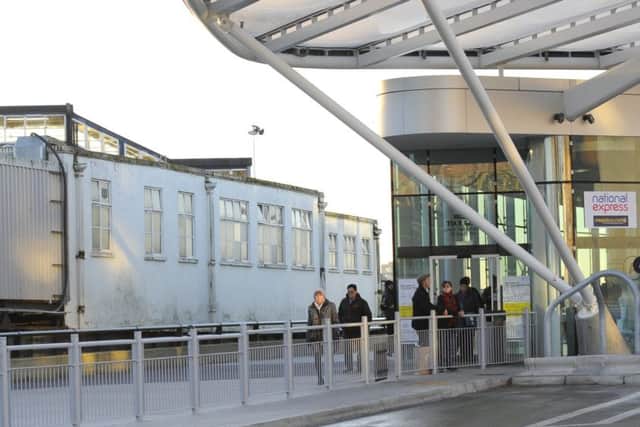 The dilapidated Portsmouth Harbour station buildings next to the gleaming new bus terminal at The Hard