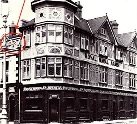 In this photo we can just make out the final lettering of the Royal Standard next to the Royal Naval Arms.