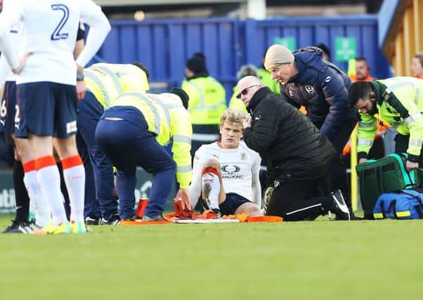 Cameron McGeehan was stretchered off for Luton last season at Pompey. Picture: Joe Pepler