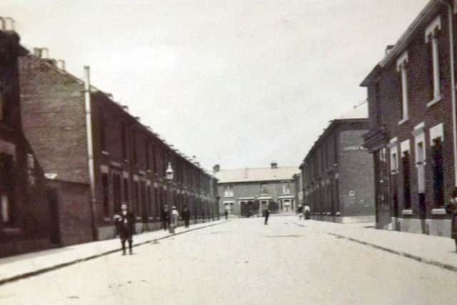 A street scene in Portsmouth. But where? It looks like the street sign says Langley Road. Anyone have a clue?
