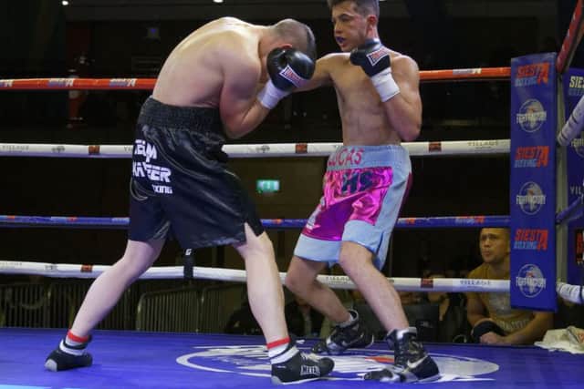 Lucas Ballingall, right, on his way to victory over Michael Dehamnia. Picture: Neil Marshall (1713340-659)