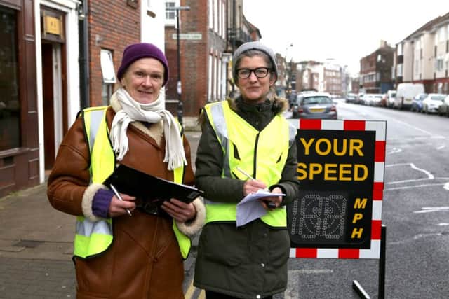 Gail Bird and Anna Koor monitor traffic speeds at High Street, Old Portsmouth