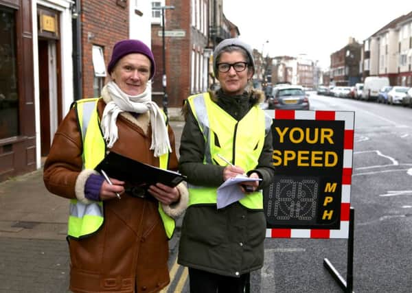 Gail Bird and Anna Koor monitor traffic speeds at High Street, Old Portsmouth