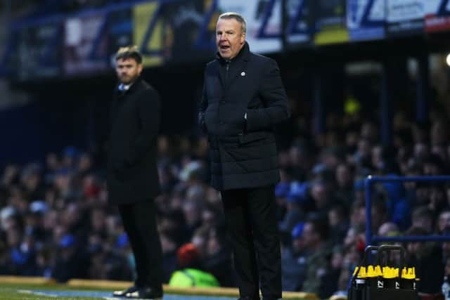 Pompey boss Kenny Jackett with Scunthorpe's Graham Alexander in the background. Picture: Joe Pepler