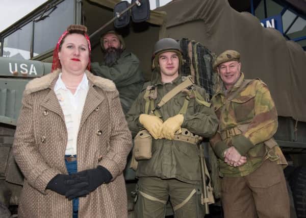 From left, Rosie Rixon, Richard Rixon, Jack Rixon and Gary Lamsdale from Hayling Island, all members of Solent Overlord Executive, with Richard's 1941 GMC CCKW swb truck Picture: Duncan Shepherd (180082-004)