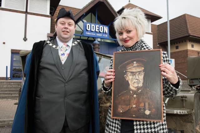 Deputy Lord Mayor of Portsmouth Lee Mason with event organiser Jo Hooper, who is holding a portrait of her great-great-uncle James Ockendon of Portsmouth who was awarded the Victoria Cross for actions while serving in the Royal Dublin Fusiliers in the First World War Picture: Duncan Shepherd (180082-014)