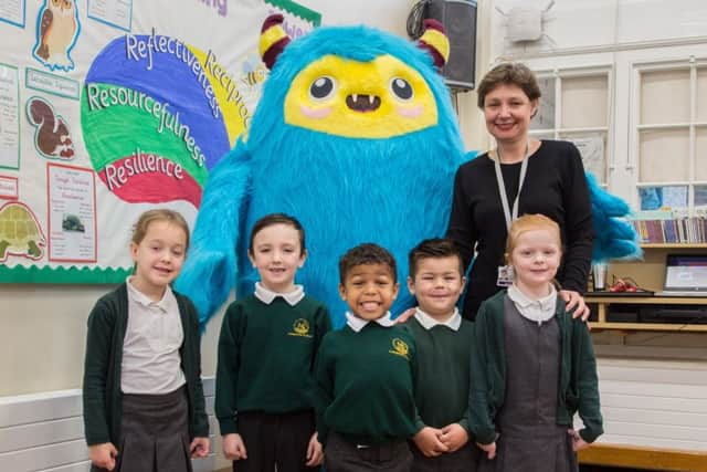 Langstone Infant School pupils with headteacher Victoria Page - from left:  Sofia Gustafsson, Cayden Rivers, Shaquille Manneh, Rio Williams and Esme Alsop